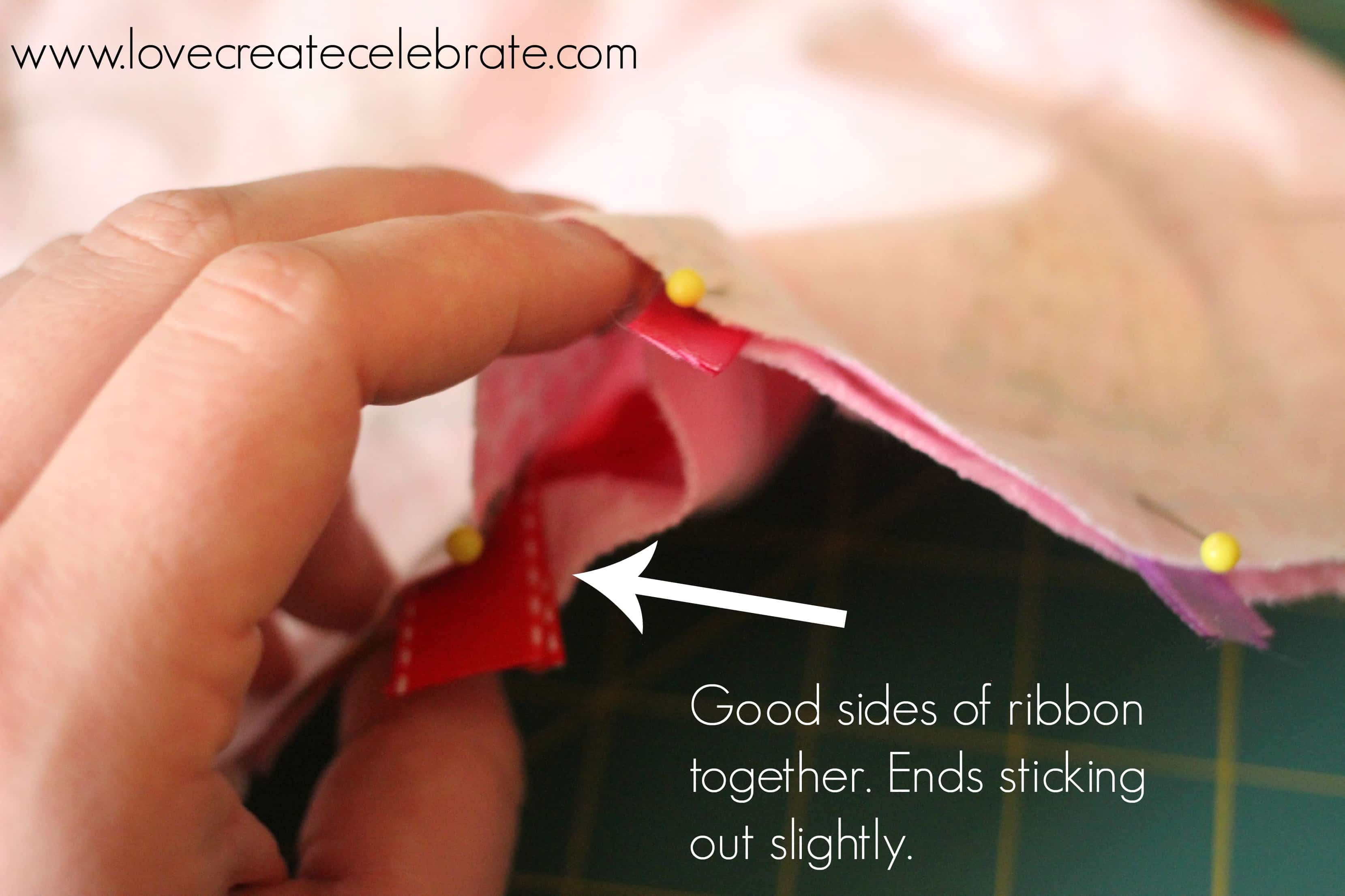 Put the good sides of the ribbon together and allow the ends to stick out slightly.
