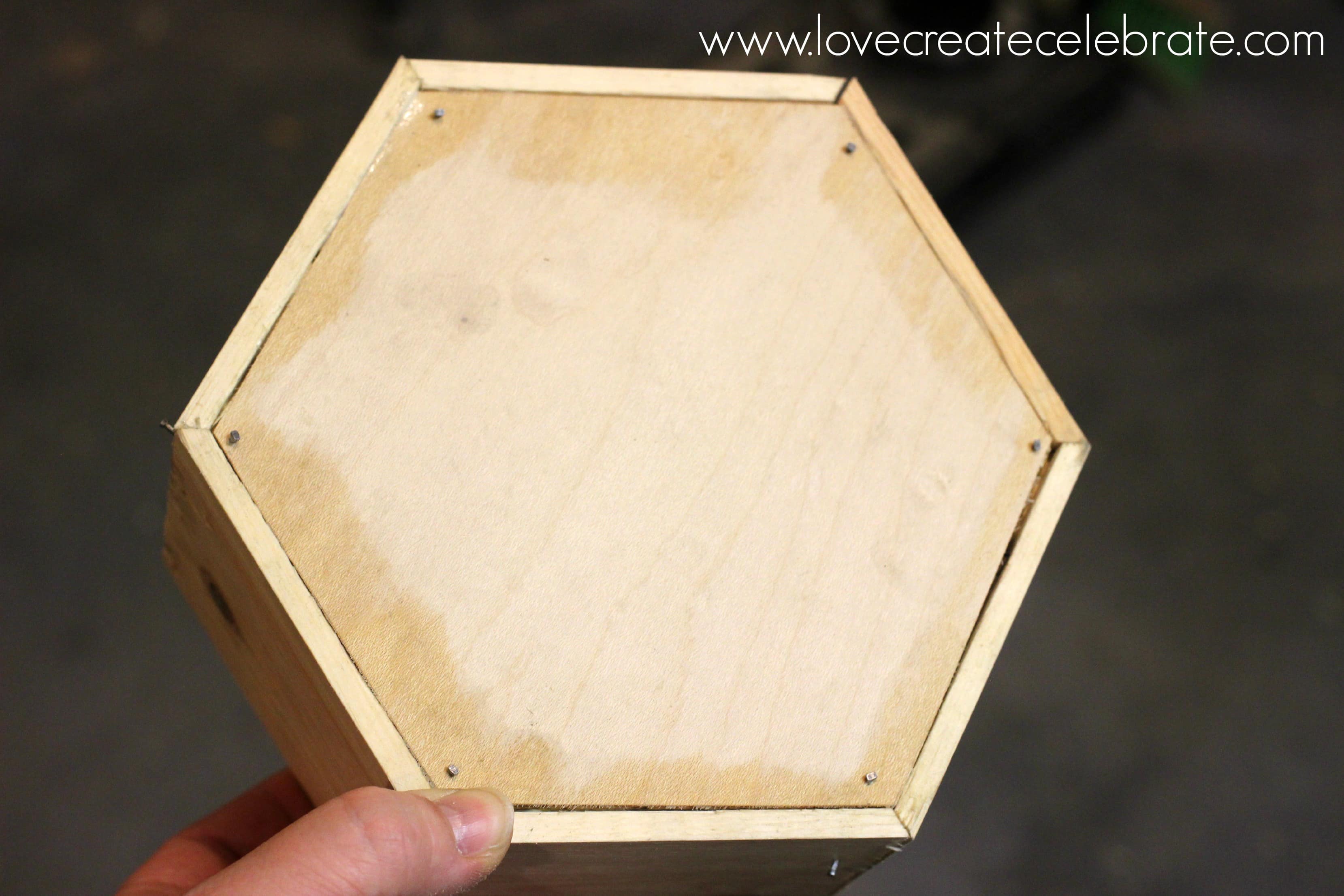 Cut your plywood piece to fit on the front of the hexagon