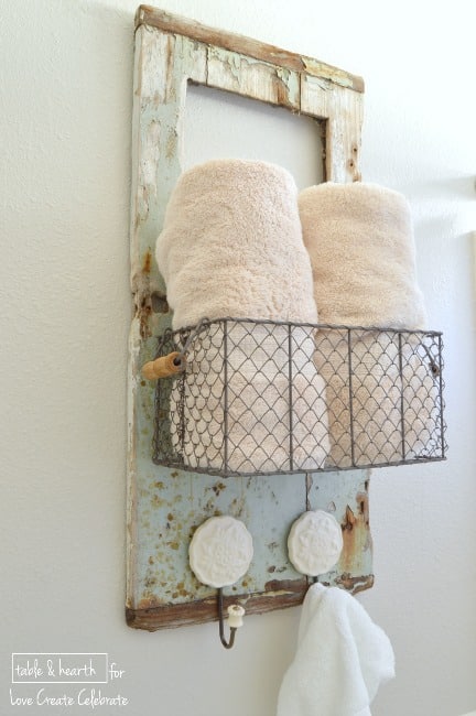 Pretty shabbiness! This blogger took an old piece of wood washed up on the beach and made this adorable rustic towel holder with it!