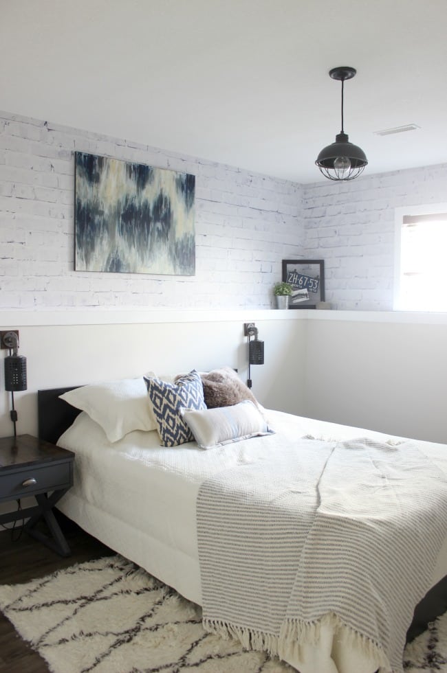 Love the mix of modern and industrial decor in this bedroom design!