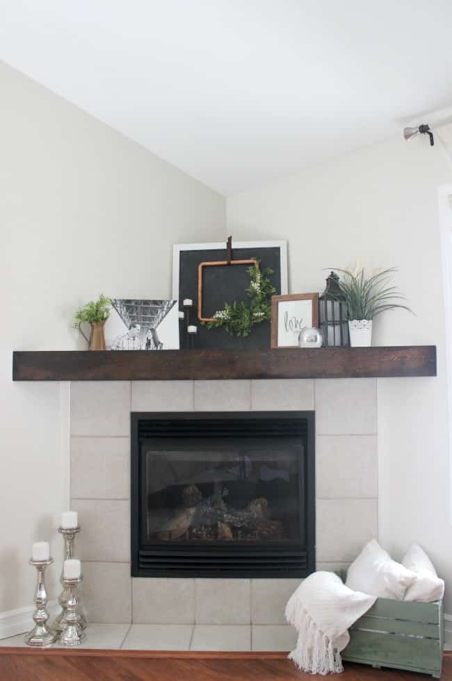 Our fireplace upgrade is complete with this DIY wooden mantle