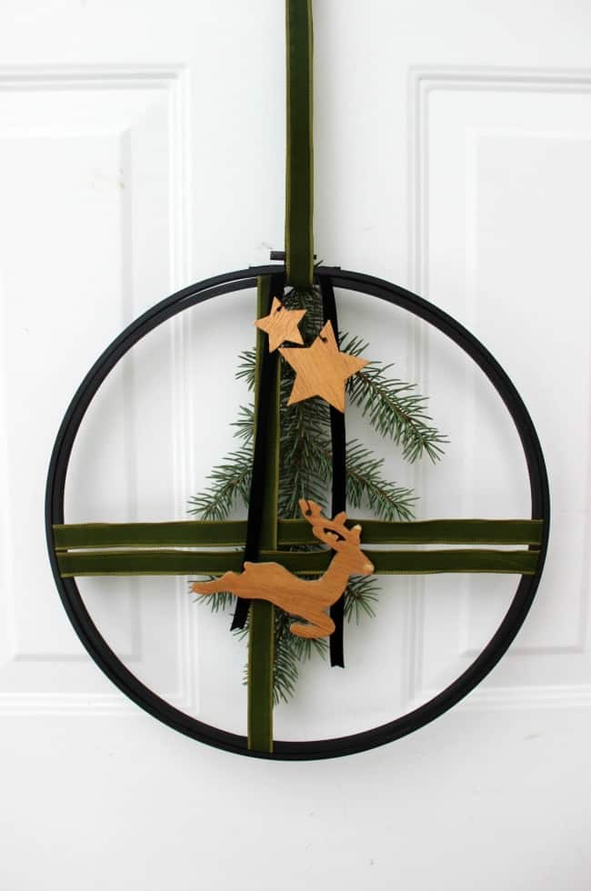 Completed modern Christmas wreath on a door.