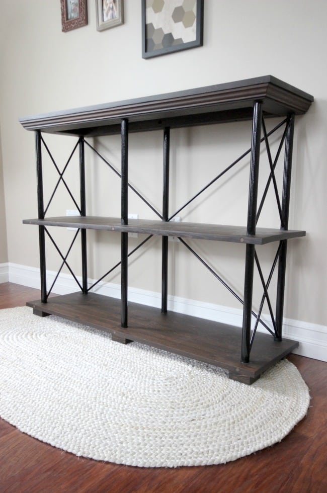 Free build plans for this beautiful rustic industrial furniture piece. This DIY shelf would look perfect in any living room, family room, or in the kitchen as a side board! Love the idea!