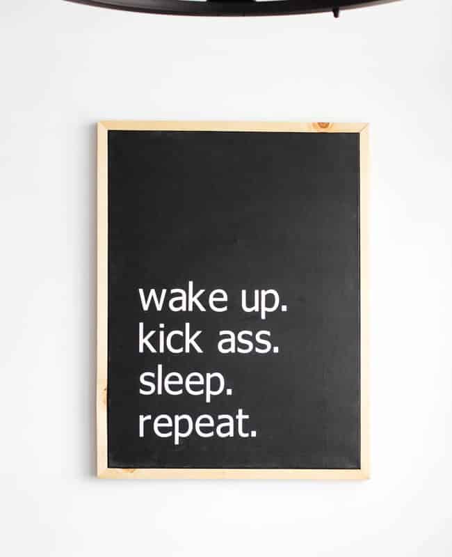 Make your own custom typography canvas with iron-on vinyl and paint. A sleek modern canvas for your bedroom or bathroom. Love the "wake up. kick ass. sleep. repeat."