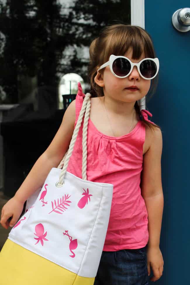 Fun personalized summer tote bag! Make it for yourself or your kids and head to the beach this summer in style. Easy to make with iron-on vinyl!