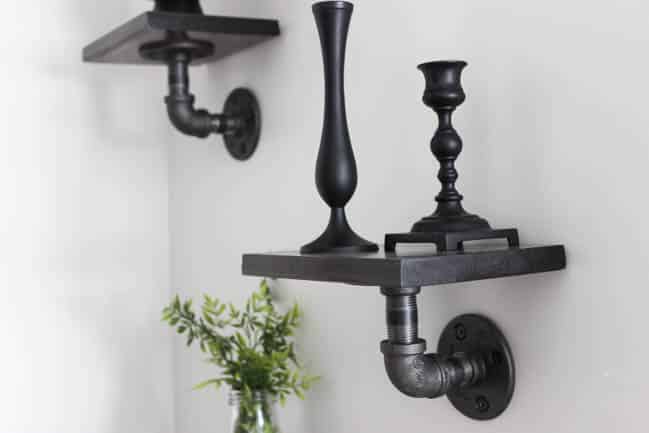These mini industrial shelves are easy to build and perfect for any empty wall! These DIY pipe shelves are modern and beautiful!