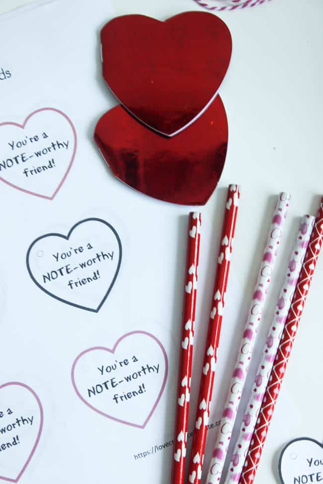 Simple Notebook Valentines using Dollar Store notebooks and pencils! Download the FREE printable Valentines now for your kids to take to school!