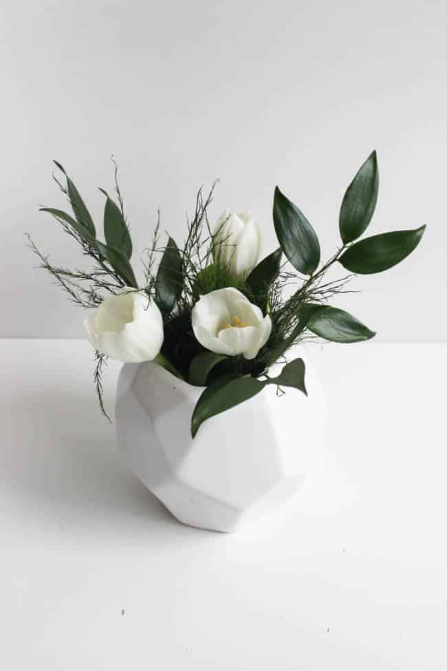 Small white vase with white flowers for the modern flower arrangements
