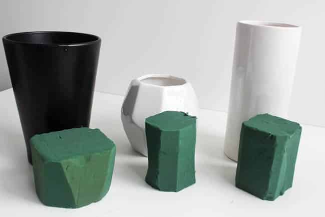 Vases with various sized foam blocks