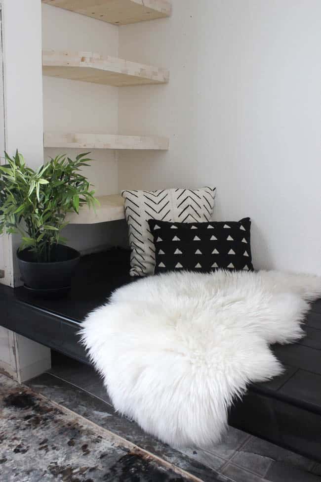 Gorgeous Tiled Entry Bench! Love the use of tile on this creative DIY project! The basalt tile looks amazing on this tiled bench seat. Great modern design for a tiled entryway!