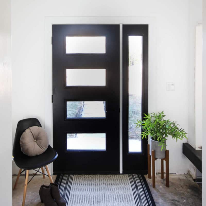 Thinking about replacing your front door? This is everything you need to know before you walk into The Home Depot and pick out a new design! We share how we got the proper measurements and picked our design elements before going to the store. Love the modern design of this new black front door!