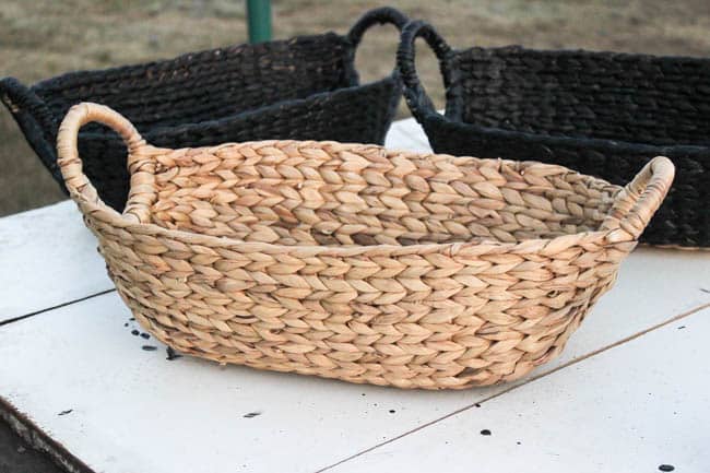 Beautiful black baskets! Make your own in five minutes by painting any old basket with the best black paint! Beautiful storage idea for this modern entry! 