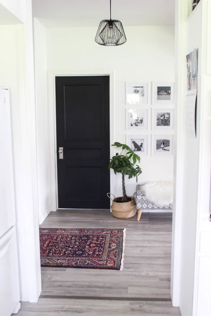 Stunning transformation! Transform outdated doors on a budget! Some trim, paint, and new hardware is all it takes to create a new modern interior door design! Love the navy blue colour on these hallway doors.