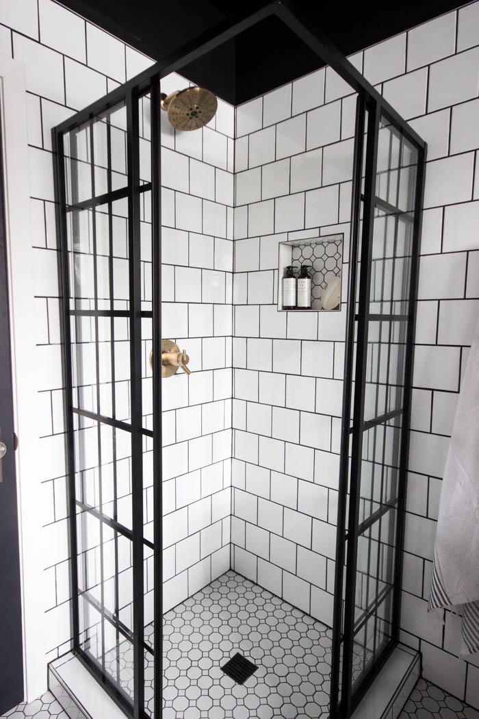 Close up view of the tile work in the shower of the modern bathroom reveal.