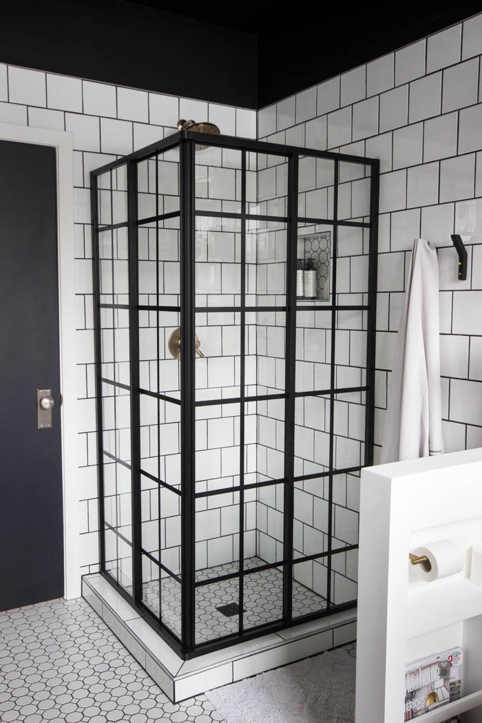 Glass enclosed shower in the modern bathroom reveal.