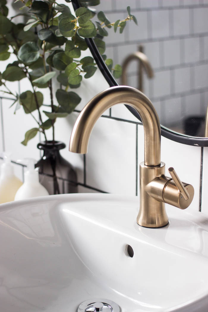 Close up of the faucet in the modern bathroom reveal.
