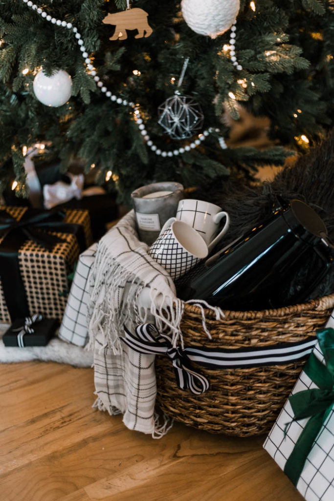 A great gift basket idea for the holiday homebody. Give them the gift of a night in with coffee, and cozy home decor! It would also be a great gift idea for couples! #Christmas #gifts #homebody 