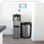 water cooler, trash and recycling with text overlay reading "How to hide your trash and recycling"