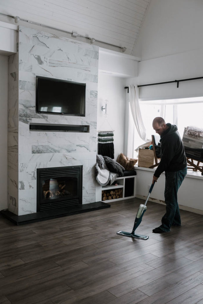 man cleaning laminate floors