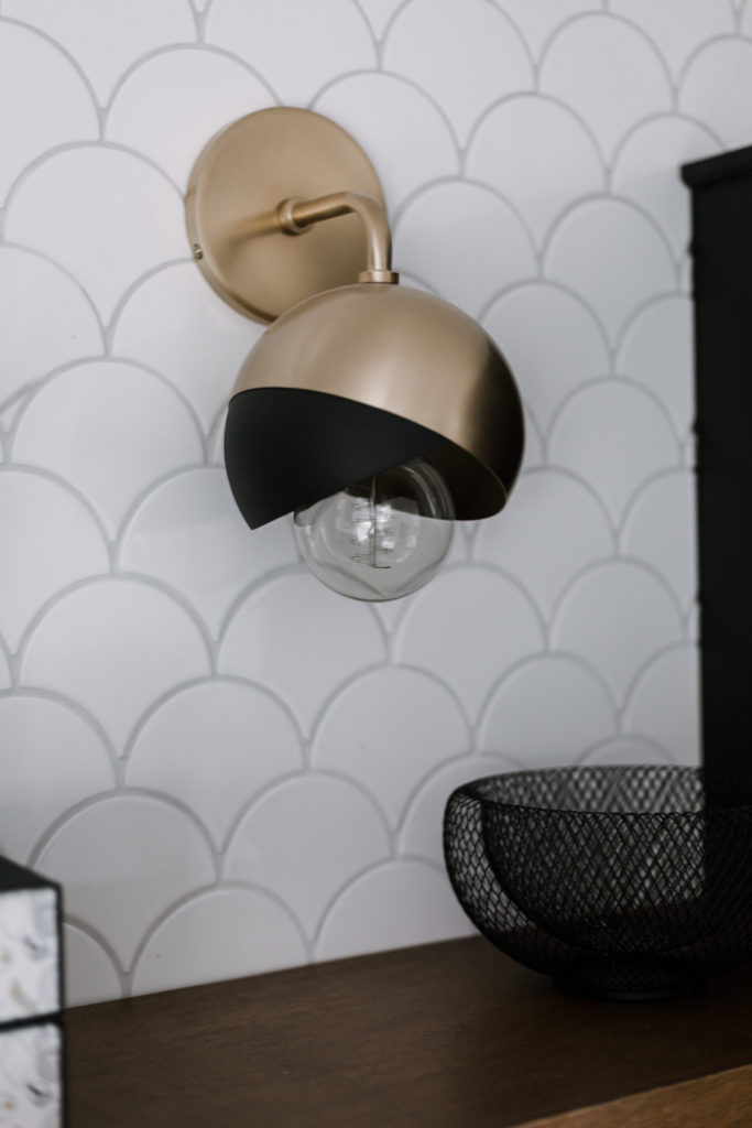 black and brass wall sconces