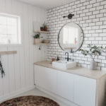new tiled accent wall in white bathroom