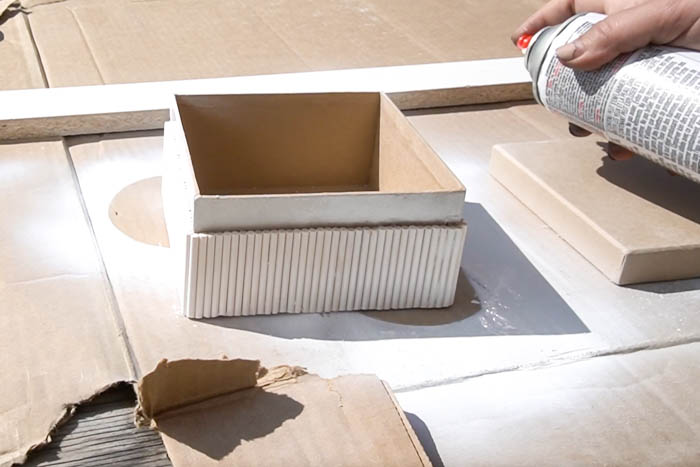 spray painting fluted box white
