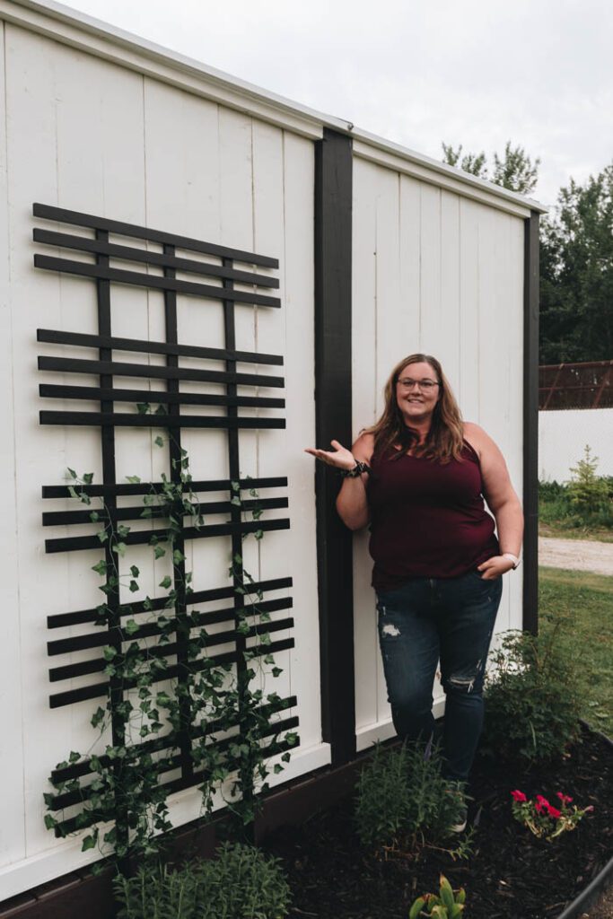 image of completed vine trellis with LIndi standing next to it