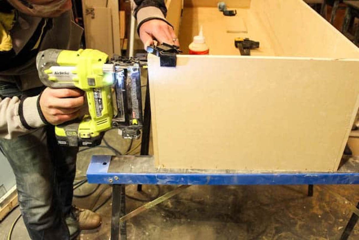Assembling the MDF boards into a box and connecting with a nail gun