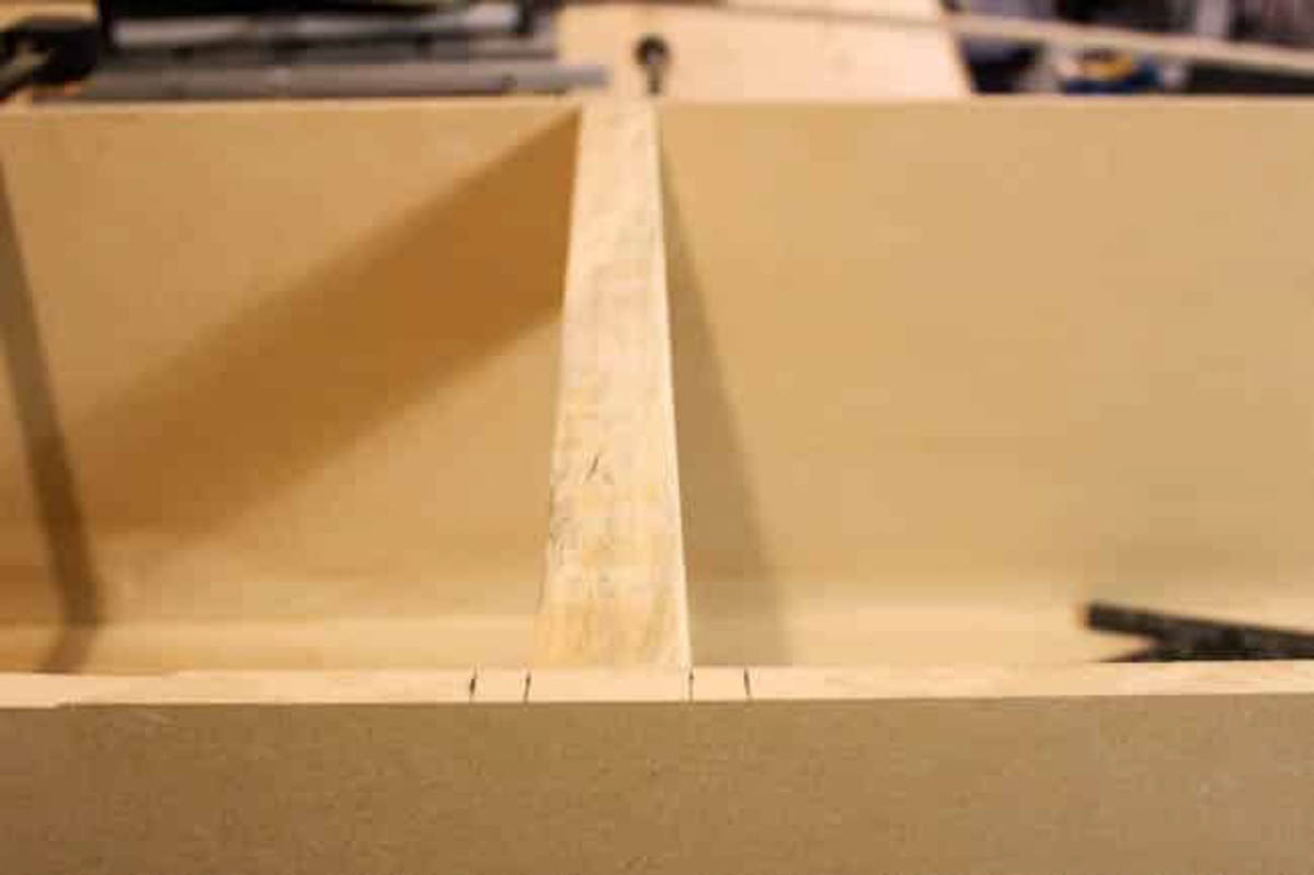 Image of MDF box with wood to lay shelves on 