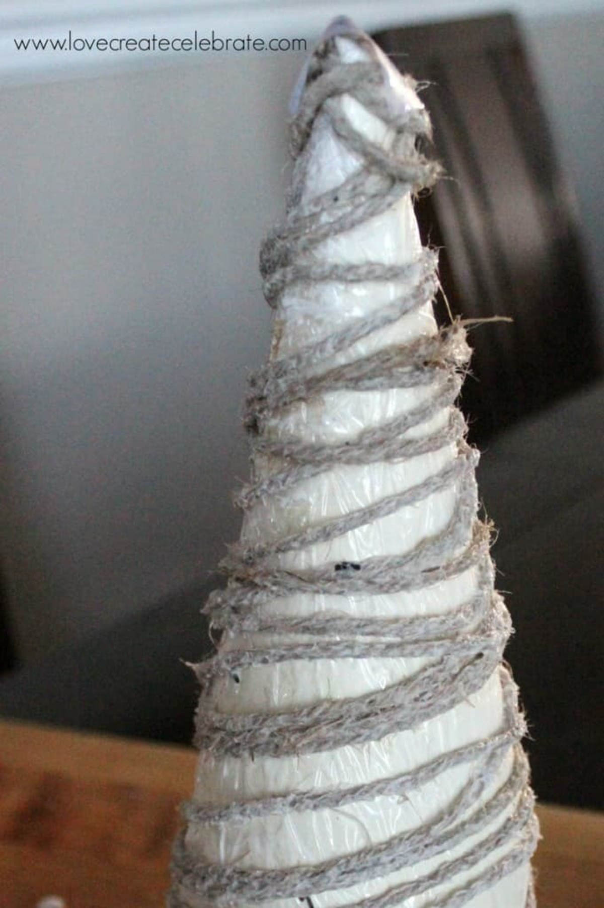 Foam cone wrapped with string to create a string Christmas tree