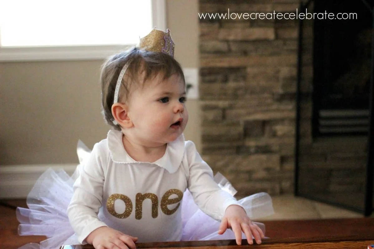 Baby in ONE onesie for first birthday