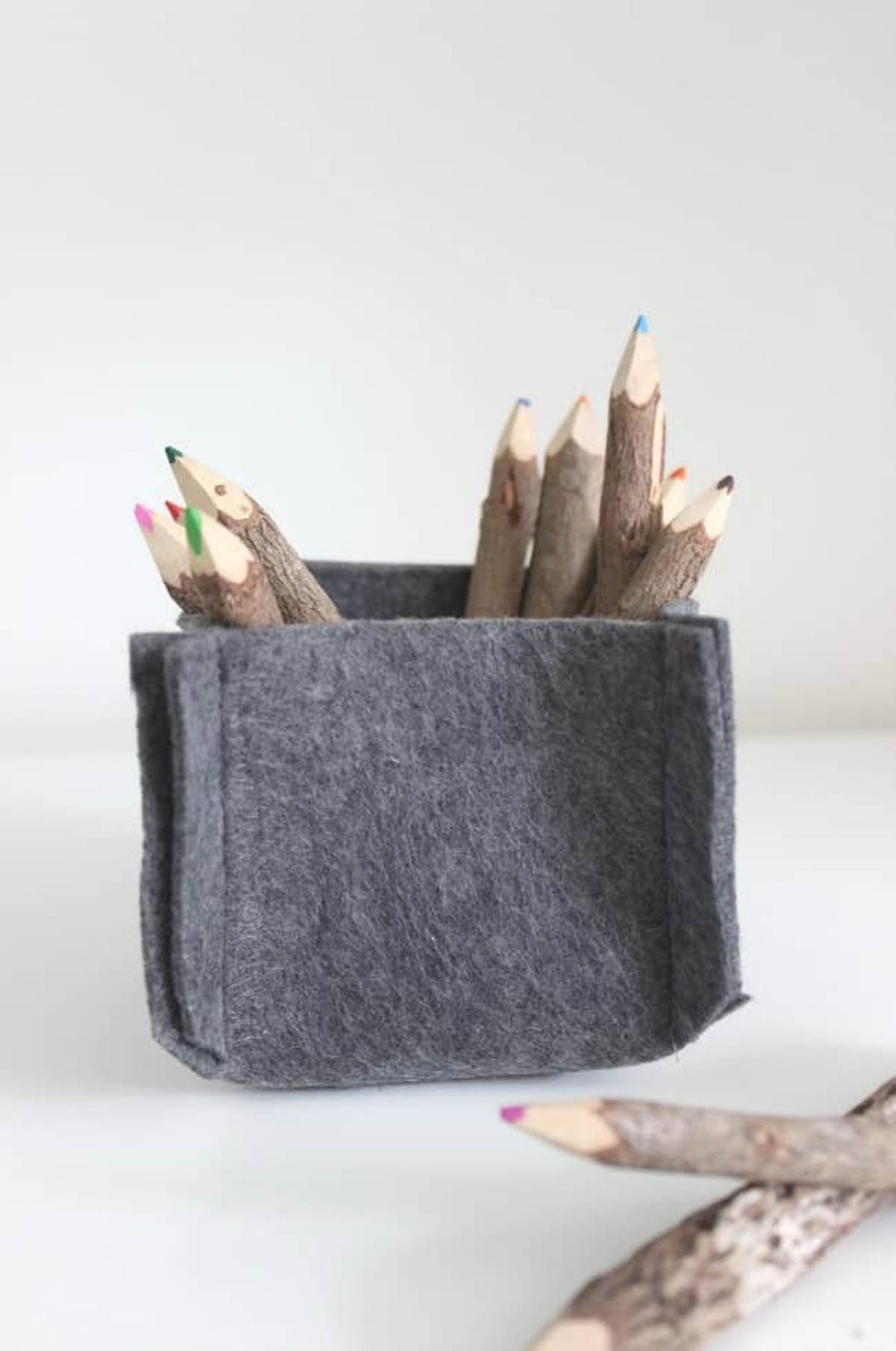 Felt container with colored pencils