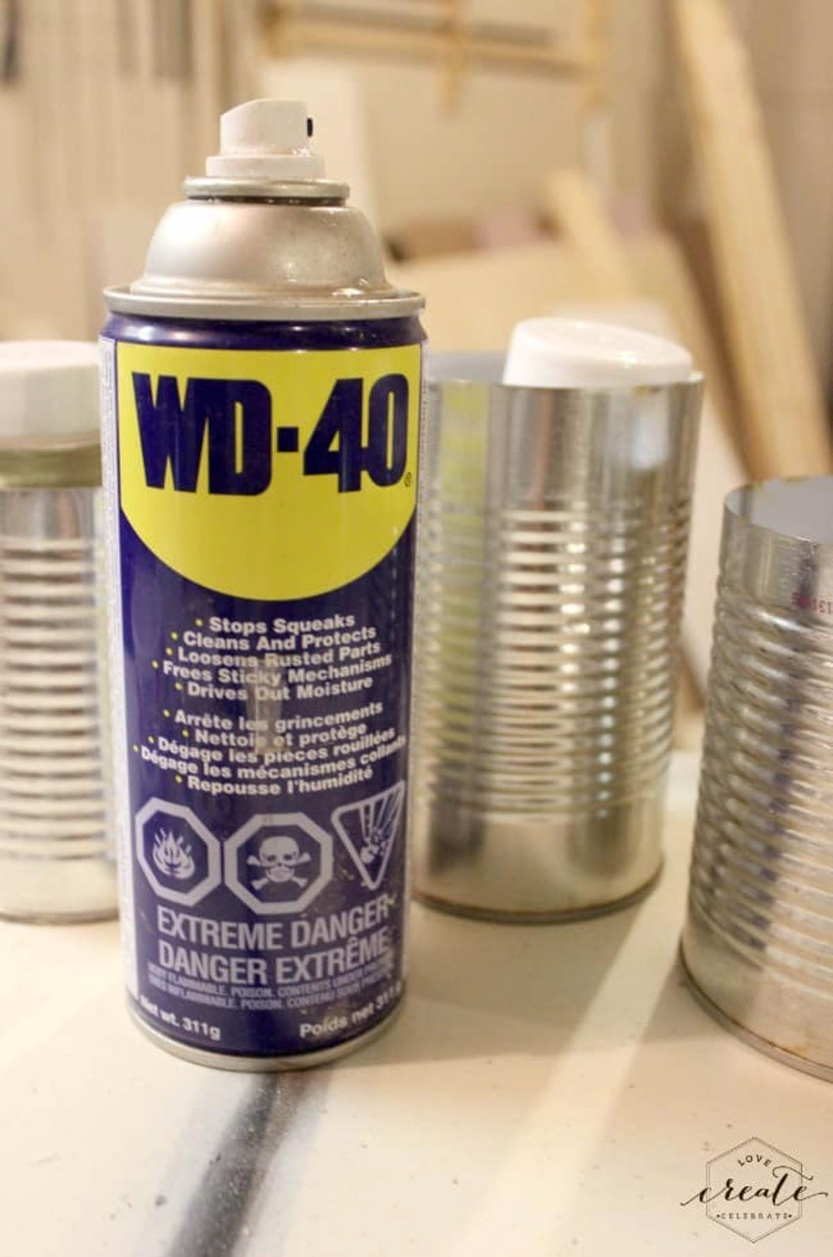 Can of WD-40 used to lubricate the tin can for easy removal