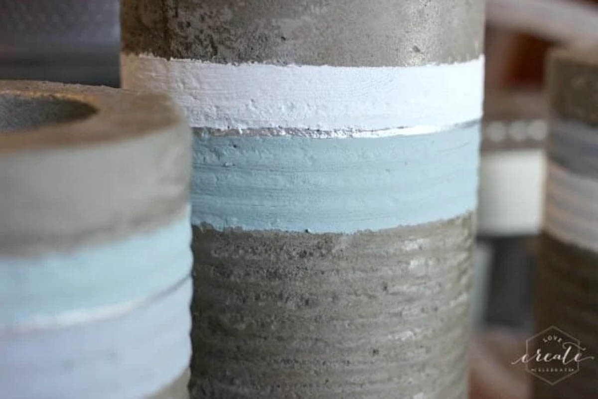 White, silver, and light blue painted concrete vase