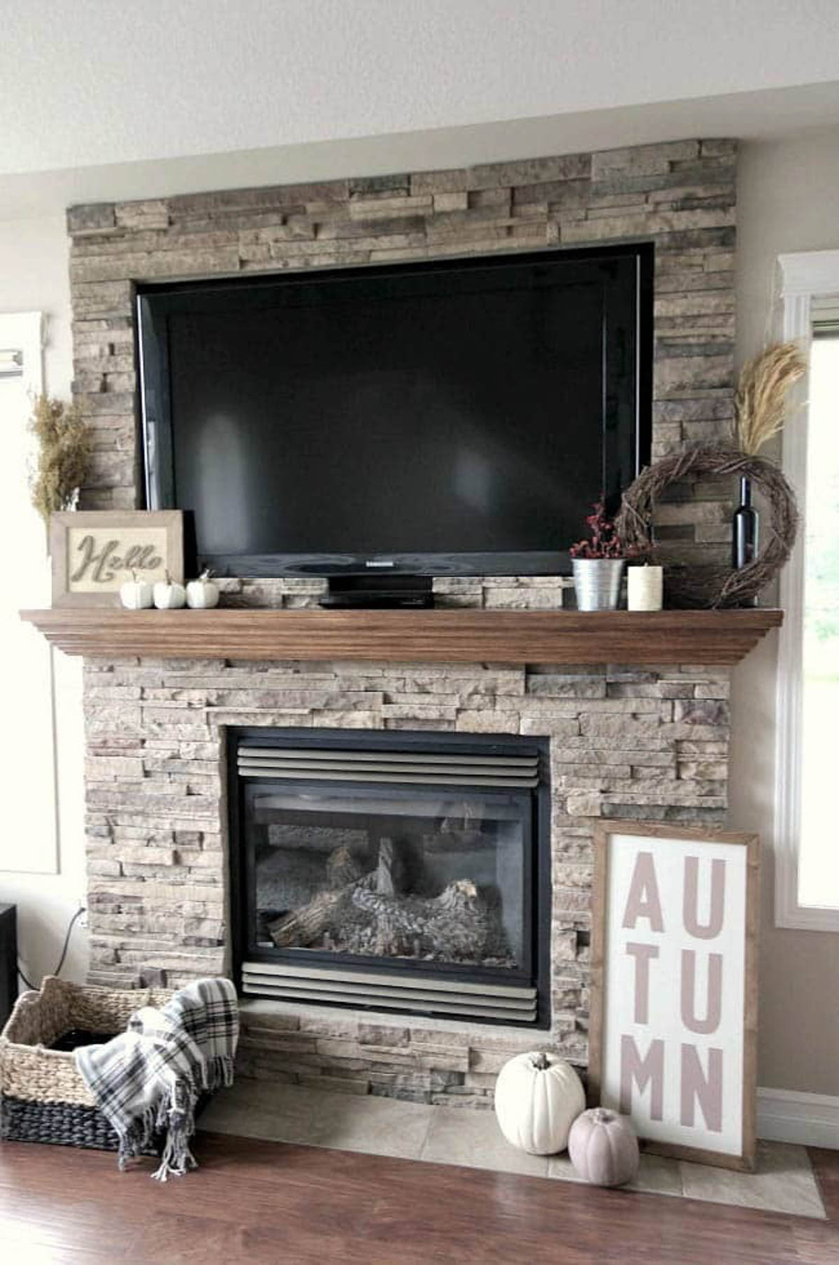 Custom wood signs decorating a fireplace