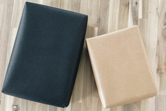 packages wrapped in black and brown kraft paper
