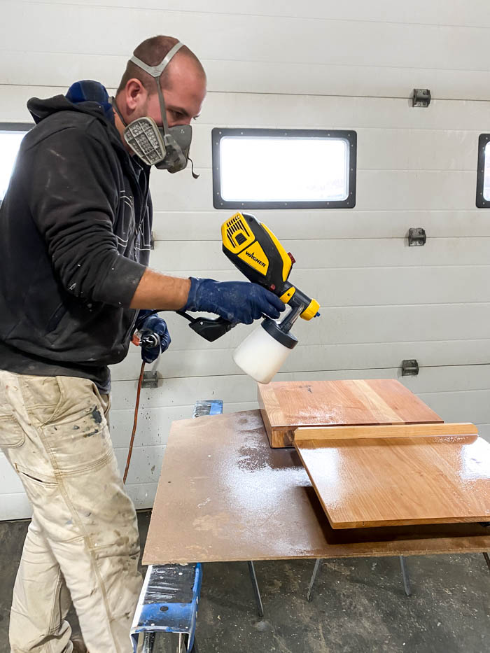 apply top protective coat on using mitre saw to cut boards for DIY Tabletop Easel