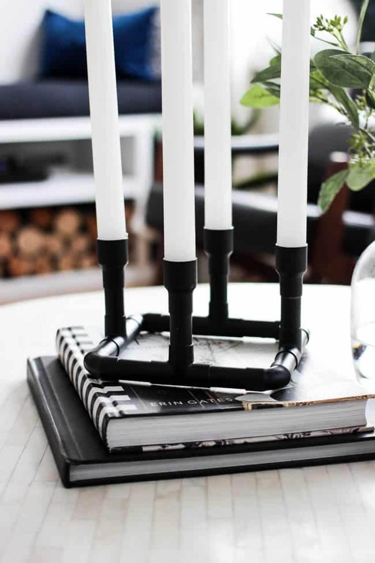 Completed DIY modern candle holder on top of books.