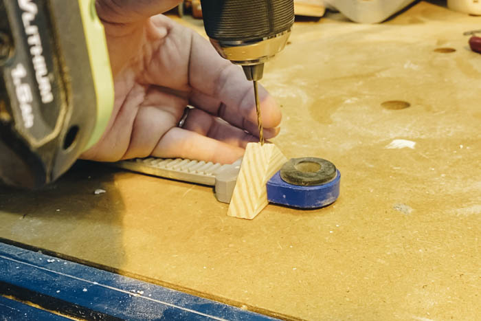 drilling hole in top of triangle wood block