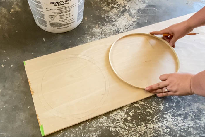 drawing circle on scrap piece of plywood