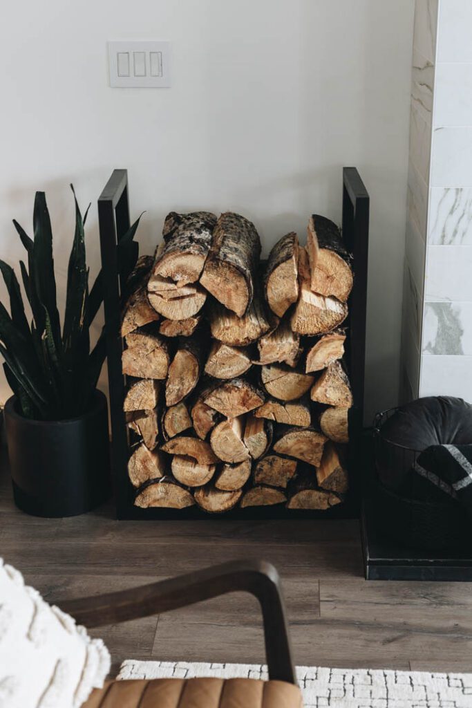 DIY fire wood rack next to fireplace with wood