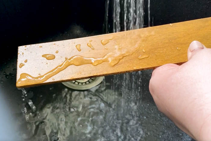 testing wood slat under running water