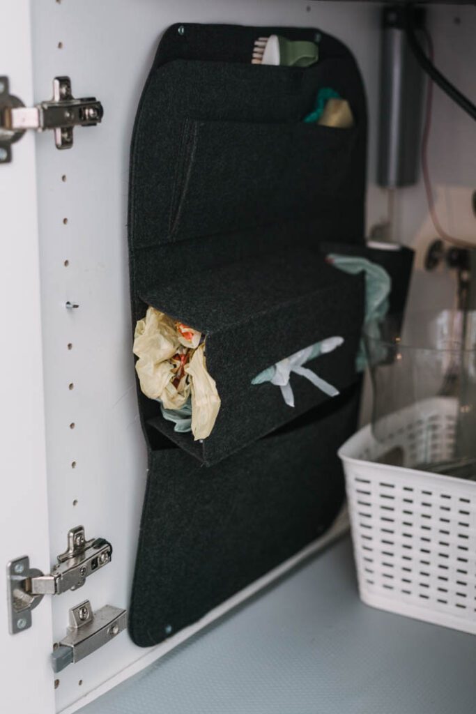DIY Under Kitchen Sink Storage for plastic bags using a car seat organizer