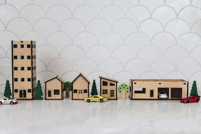 Mini city buildings made from a Glowforge machine
