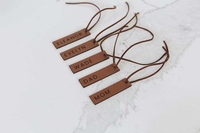 Tags that say Eleanor, Evelyn, Wade, Dad and Mom made from a Glowforge machine