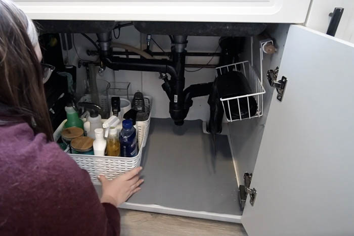 organized storage space under the sink