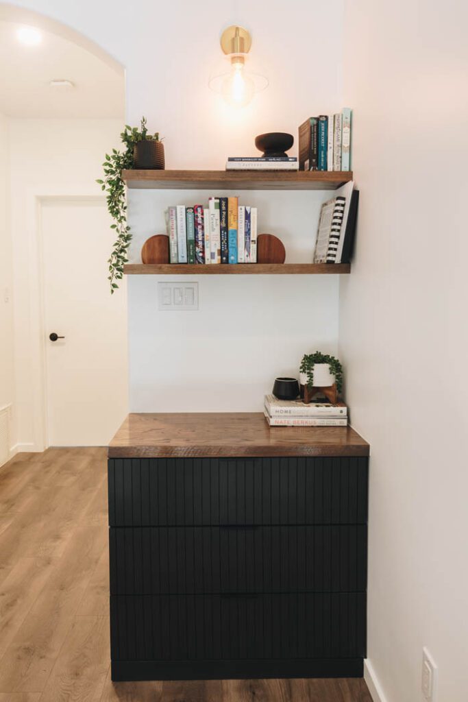 modern black cabinet and floating shelves