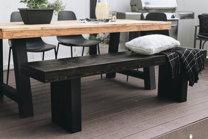teak table with bench on outdoor patio