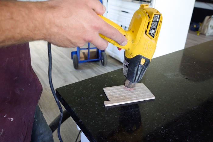 using a heat gun to dry the tile